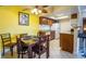 Bright kitchen featuring tile flooring, wooden cabinets and a dining table at 4200 S Valley View Blvd # 1077, Las Vegas, NV 89103