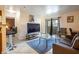 Inviting living room with a large TV, plush sofa, and stylish decor at 4200 S Valley View Blvd # 1077, Las Vegas, NV 89103