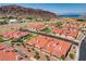 Beautiful aerial view of a community, featuring red tile roofs, mature landscaping and panoramic views at 445 Intrepid Ct, Boulder City, NV 89005