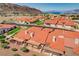 An elevated view of the community with distinctive red tile roofs and scenic mountain backdrop at 445 Intrepid Ct, Boulder City, NV 89005