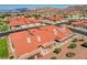 Aerial view of community featuring red tile roofs, private patios, and desert landscaping at 445 Intrepid Ct, Boulder City, NV 89005
