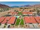 An aerial perspective showcasing a community's neat rows of homes, with the inviting community pool at 445 Intrepid Ct, Boulder City, NV 89005