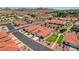 An aerial shot showing the community's tiled roofs, desert landscaping, and the distant mountains at 445 Intrepid Ct, Boulder City, NV 89005