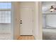Home entryway featuring a white front door, tile flooring, and lots of natural light at 445 Intrepid Ct, Boulder City, NV 89005