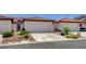 Charming townhome featuring a tile roof, two-car garage, and low-maintenance landscaping in a desirable community at 445 Intrepid Ct, Boulder City, NV 89005