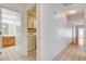Hallway with tile flooring providing a view of the bathroom and laundry area at 445 Intrepid Ct, Boulder City, NV 89005