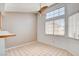 Eat-in kitchen area featuring tile floors, a ceiling fan, and a large window at 445 Intrepid Ct, Boulder City, NV 89005