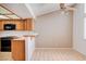 Kitchen with a ceiling fan, tile floors, wood cabinets, and lots of natural light at 445 Intrepid Ct, Boulder City, NV 89005