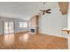 Inviting living room with a fireplace, wood-look flooring, sliding doors, and plenty of natural light at 445 Intrepid Ct, Boulder City, NV 89005