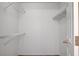 Bright walk-in closet with multiple wire shelves for optimal storage and organization at 445 Intrepid Ct, Boulder City, NV 89005