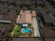 Stunning aerial view of a home featuring a private pool, lush landscaping, and ample parking at 4620 E Suntree Ct, Pahrump, NV 89061