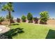 A backyard with artificial turf, and gravel creates an inviting outdoor space at 4620 E Suntree Ct, Pahrump, NV 89061