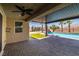 Backyard featuring private pool with waterfall and outdoor kitchen area at 4620 E Suntree Ct, Pahrump, NV 89061