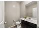 Cozy powder room featuring a vanity with dark cabinets and a decorative plant at 4620 E Suntree Ct, Pahrump, NV 89061