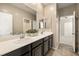 Bathroom featuring double sinks, modern fixtures, and ample counter space at 4620 E Suntree Ct, Pahrump, NV 89061
