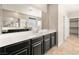 Bathroom with single vanity, large mirror and walk-in closet at 4620 E Suntree Ct, Pahrump, NV 89061
