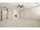 Bedroom featuring neutral paint and carpet, ceiling fan, and view to kitchen at 4620 E Suntree Ct, Pahrump, NV 89061