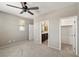 Bedroom with ceiling fan and connected bathroom and closet at 4620 E Suntree Ct, Pahrump, NV 89061