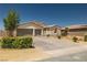 Attractive single-story home with a two-car garage, neat landscaping, and an American flag at 4620 E Suntree Ct, Pahrump, NV 89061