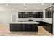 Modern kitchen with a large island, granite countertops, and dark cabinetry at 4620 E Suntree Ct, Pahrump, NV 89061
