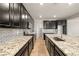 Modern kitchen with stainless steel appliances, dark cabinets and granite counters at 4620 E Suntree Ct, Pahrump, NV 89061