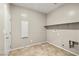 Functional laundry room with tiled floor and essential hookups at 4620 E Suntree Ct, Pahrump, NV 89061