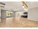 Open-concept living room with tile floors and view of the pool at 4620 E Suntree Ct, Pahrump, NV 89061
