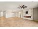 Spacious living room with tile floors, modern fireplace and fan at 4620 E Suntree Ct, Pahrump, NV 89061