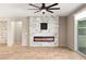 Modern living room with fireplace feature wall and tile flooring at 4620 E Suntree Ct, Pahrump, NV 89061