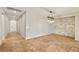 Bright living room with wood-look tile flooring and stone-accented wall at 4620 E Suntree Ct, Pahrump, NV 89061