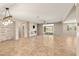 A spacious living room with stone accent wall, fireplace, and access to a pool area at 4620 E Suntree Ct, Pahrump, NV 89061