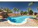 Backyard pool features a water feature, slide, lush landscaping, and ample space to play at 4620 E Suntree Ct, Pahrump, NV 89061