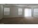 Spacious living area filled with natural light and seamless carpet at 520 Shire Hall St, Las Vegas, NV 89178