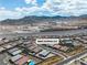 Scenic aerial view of 5264 Mystic Ivy with mountain backdrop and the highway nearby at 5264 Mystic Ivy Dr, Las Vegas, NV 89149