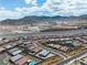Scenic aerial view of the community with highway nearby and desert mountain range in background at 5264 Mystic Ivy Dr, Las Vegas, NV 89149