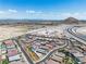 Community aerial view showing new homes, vacant lots and the Las Vegas skyline at 5264 Mystic Ivy Dr, Las Vegas, NV 89149