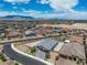Aerial view of a neighborhood, showing the house, street, and landscape at 5264 Mystic Ivy Dr, Las Vegas, NV 89149