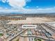 A bird's-eye view of an established suburban neighborhood against a backdrop of mountains at 5264 Mystic Ivy Dr, Las Vegas, NV 89149