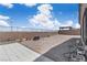 Large backyard featuring a concrete patio, gravel area, and block wall at 5264 Mystic Ivy Dr, Las Vegas, NV 89149
