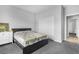 This bedroom features carpet, white walls, and a gray bed frame at 5264 Mystic Ivy Dr, Las Vegas, NV 89149