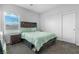 Bedroom with a queen-size bed, wood accents, and ample closet space at 5264 Mystic Ivy Dr, Las Vegas, NV 89149