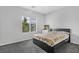 Cozy bedroom with carpeted floors, natural light, and a calming color palette, creating a serene atmosphere at 5264 Mystic Ivy Dr, Las Vegas, NV 89149
