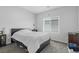 Bedroom featuring a comfortable bed, neutral walls, and a large window at 5264 Mystic Ivy Dr, Las Vegas, NV 89149