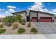 Charming single-story home with a well-manicured front yard and a two-car garage in a vibrant community at 5264 Mystic Ivy Dr, Las Vegas, NV 89149