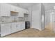 This kitchen features white cabinets and tile floors at 5264 Mystic Ivy Dr, Las Vegas, NV 89149