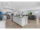 Modern kitchen featuring an island with granite countertops and stainless steel appliances at 5264 Mystic Ivy Dr, Las Vegas, NV 89149