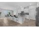 This kitchen features an island with bar stool seating at 5264 Mystic Ivy Dr, Las Vegas, NV 89149
