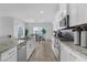 Bright kitchen featuring granite countertops, stainless steel appliances, and tile floors at 5264 Mystic Ivy Dr, Las Vegas, NV 89149