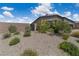 Low maintenance desert landscaping, including rock cover and native plants at 5264 Mystic Ivy Dr, Las Vegas, NV 89149