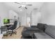 This living room features gray walls, a couch and ceiling fan at 5264 Mystic Ivy Dr, Las Vegas, NV 89149
